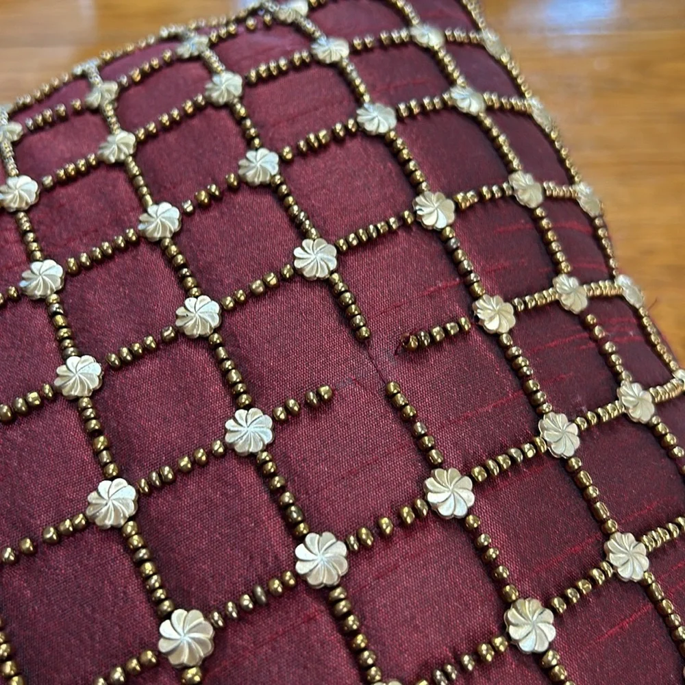 Pier 1 wine accent pillow with beaded details in gold.  Some beads missing. 16”.